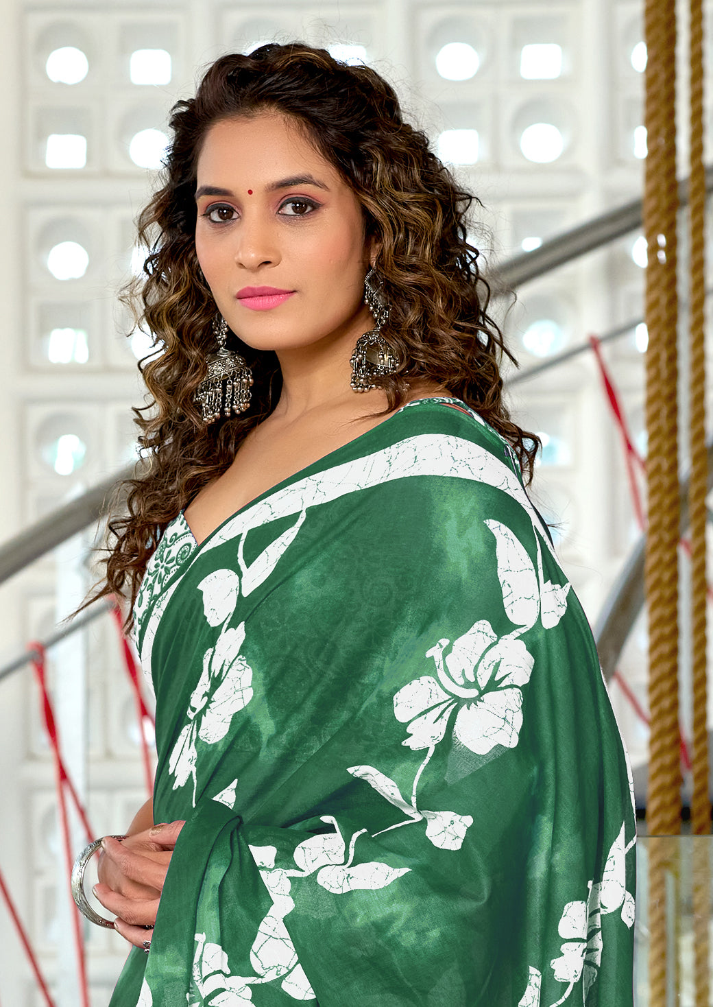 PETAL PARADISE FLORAL HAND PRINT MULMUL COTTON BOTTEL GREEN SAREE