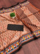 MALAVIKA PURE MULMUL COTTON IKKAT PRINTD LIGHT BROWN SAREE