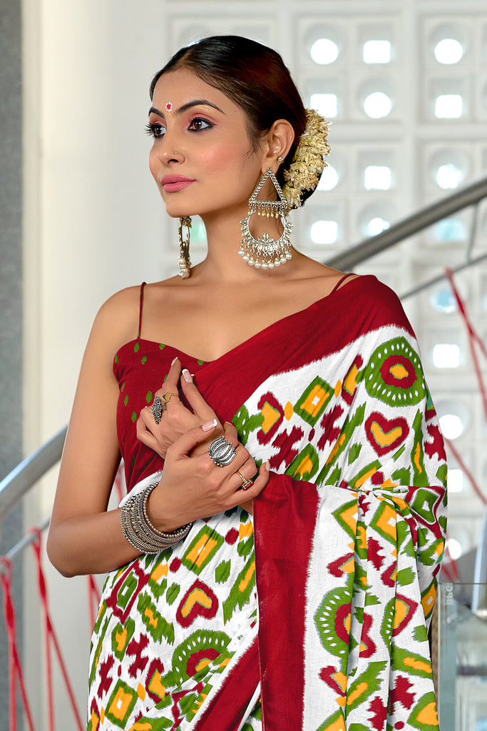 NAYANTHARA PURE MULMUL COTTON IKKAT PRINTD MARRON AND GREEN SAREE