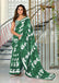 PETAL PARADISE FLORAL HAND PRINT MULMUL COTTON BOTTEL GREEN SAREE