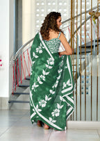PETAL PARADISE FLORAL HAND PRINT MULMUL COTTON BOTTEL GREEN SAREE