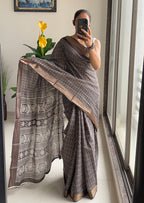 SELFI PRIMUM MULMUL COTTON WITH HEVY ZARI BORDAR BAGRU BANDHANI PRINTED DARK BROWN SAREE