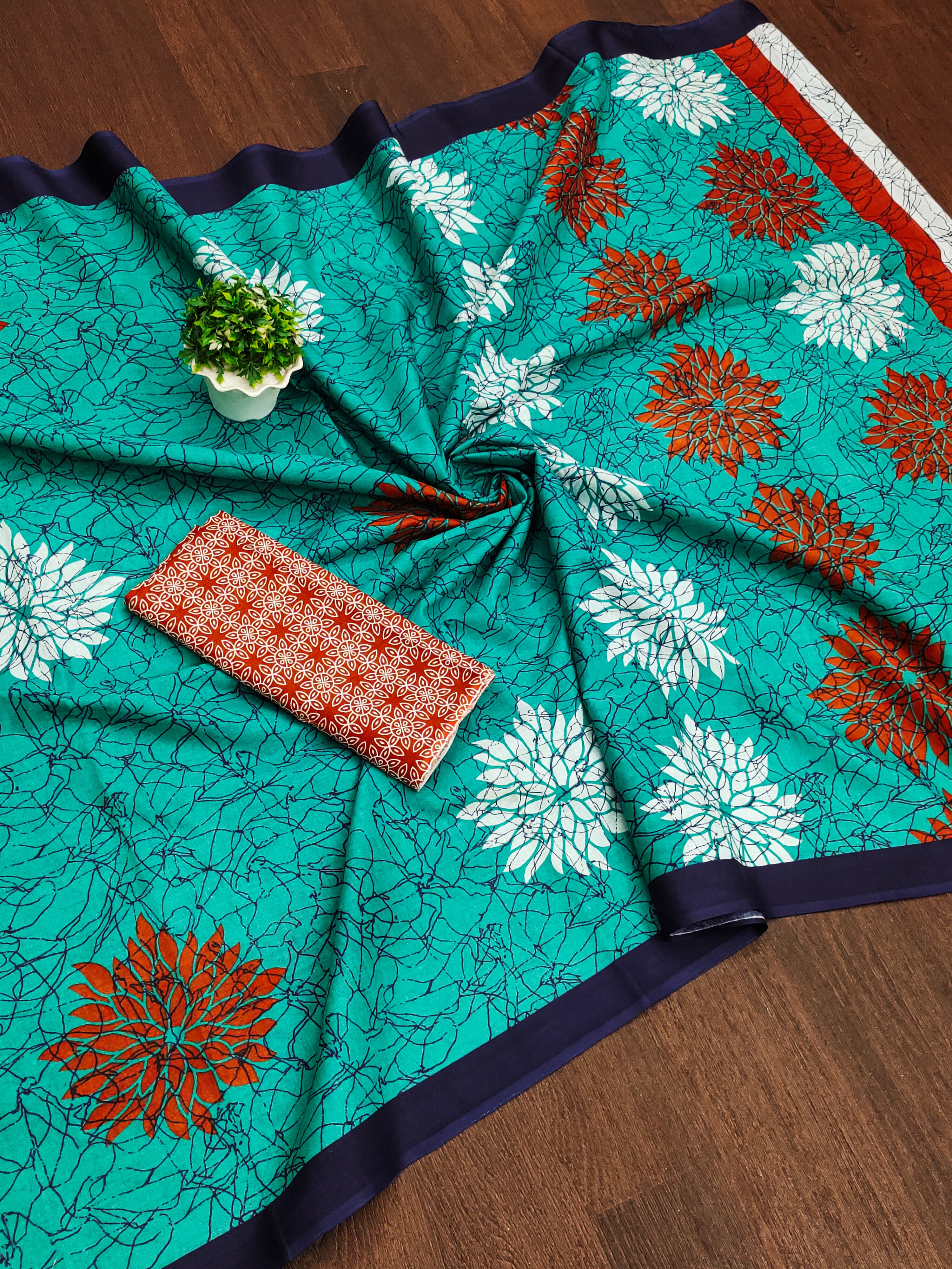 SRIVIDYA PURE MULMUL FLORAL BLOCK PRINTD AQUA SAREE