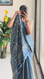 SELFI PRIMUM MULMUL COTTON WITH HEVY ZARI BORDAR BAGRU BANDHANI PRINTED TEAI BLUE SAREE